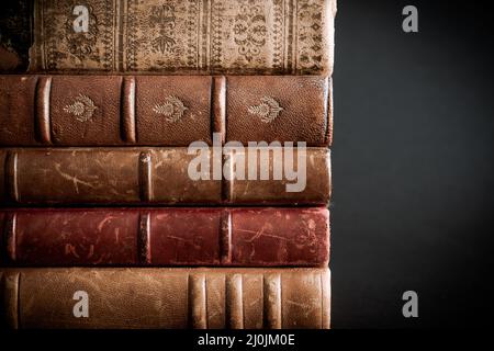 Stack of old books on black background Stock Photo