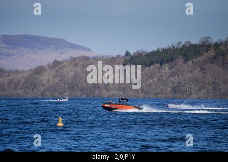 uk weather: Duck Bay, Scotland , 19th March 2020, Spring is in the air at duck bay today as people gather to enjoy the sun, have bbq's, jet ski and sun bathe