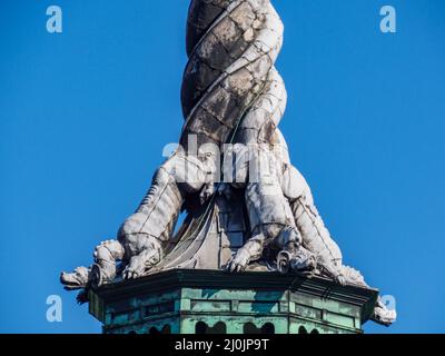 Copenhagen, Denmark - July, 2021: Spire, shaped as the tails of four dragons twined together, reaching a height of 56 metres on the Børsen -17th-centu Stock Photo