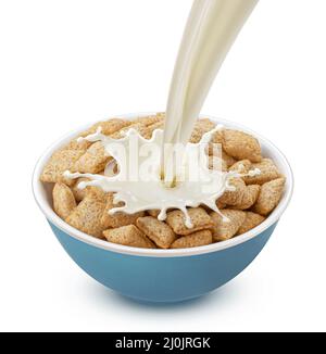 Corn pads with pouring milk isolated on white background Stock Photo