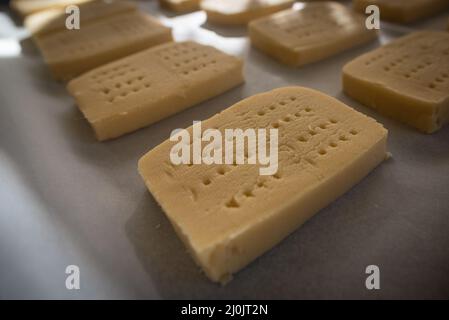 Preparing an old recipe of shortbread at home wit lots of butter. Stock Photo
