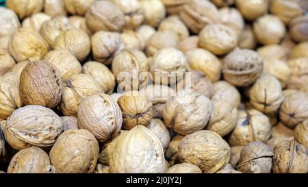 mountain of walnuts on a supermarket shelf Stock Photo