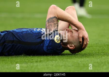 Milan, Italy. 19th Mar, 2022. Milan Skriniar (FC Internazionale) reacts after being hit hard during Inter - FC Internazionale vs ACF Fiorentina, italian soccer Serie A match in Milan, Italy, March 19 2022 Credit: Independent Photo Agency/Alamy Live News Stock Photo