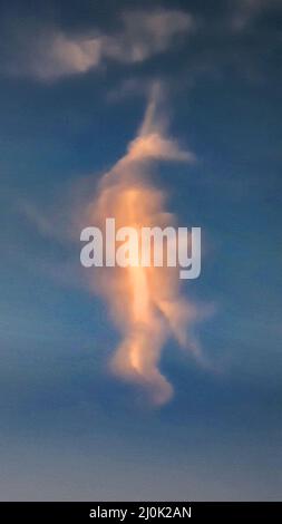 Orange Cloud Over Blue Sky Stock Photo