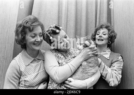 Coronation Street's Thelma Barlow (Mavis Riley), Jean Alexander (Hilda Ogden) and Barbara Knox (Rita Sullivan) with the Street's cat. November 1980. Stock Photo