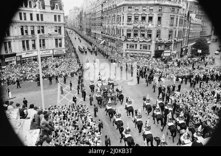 HRH Prince Charles, The Prince of Wales, marries Lady Diana Spencer. Picture shows Charles and Diana riding in a horse drawn carriage away from St Paul's Cathedral after their wedding ceremony.  In this picture they are have travelled down Ludgate Hill, and are seen here crossing Ludgate Circus and onto Fleet Street, London, EC4.  They will eventually arrive at Buckingham Palace.  Thousands of well wishers turn out to see the happy couple.  They line the streets, and find any available vantage point they can get.  Picture taken 29th July 1981 Stock Photo