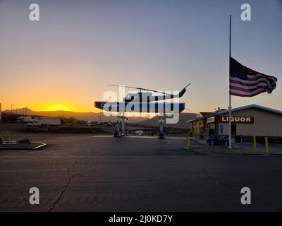 Sunrise at a California gas station with helicopter on the roof, in Jacumba, California, just off Interstate 8 Stock Photo