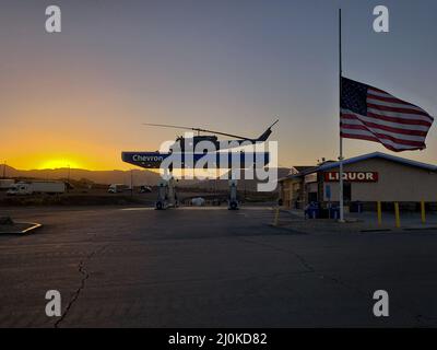 Sunrise at a California gas station with helicopter on the roof, in Jacumba, California, just off Interstate 8 Stock Photo