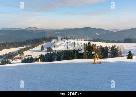 Panoramic winter view of Beskid Sadecki mountains from ski slope in Krynica Zdroj, Poland Stock Photo