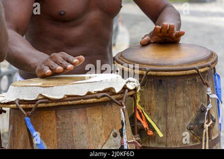 Brazilian musician playing atabaque which is a percussion instrument of African origin Stock Photo