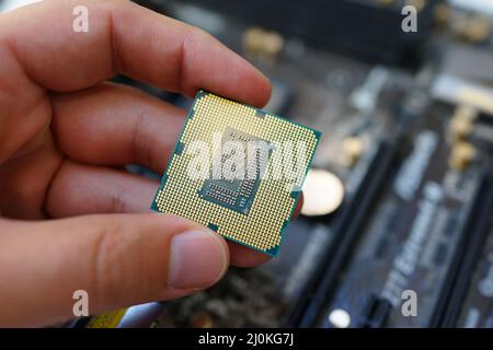 Working on motherboard and pc processor and memory Stock Photo