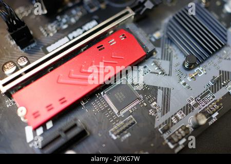 Working on motherboard and pc processor and memory Stock Photo