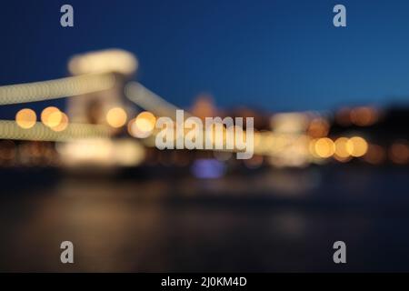 Out of focus shot of the Szechenyi Chain Bridge in Budapest, Hungary at night Stock Photo