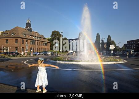 Monheim Geyser in the roundabout with rainbow, Monheim am Rhein, Germany, Europe Stock Photo