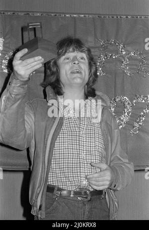 Bassist John Paul Jones holding an award for Englis rock band Led Zeppelin at a Melody Maker Poll awards ceremony in London, England, in 1979. Stock Photo