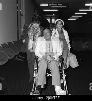 Joan Collins with husband Ron Kass and daughter Katyana arriving at Heathrow from Los Angeles. 3rd November 1982. Stock Photo