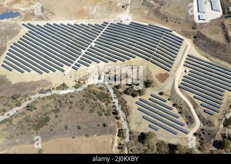 Aerial drone view of Solar panel photovoltaic farm. Alternative renewable energy. Sustainable resources. Stock Photo