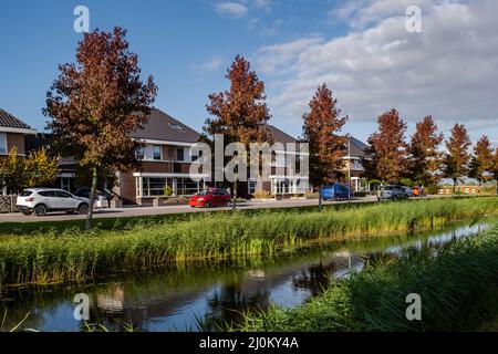 Dutch Suburban area with modern family houses, newly build modern family homes in the Netherlands, dutch family house, apartment Stock Photo