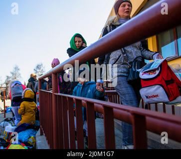 Przemysl, Poland. 19th Mar, 2022. People are seen boarding a train to Lviv. Ukrainians return to Ukraine from Poland by train. Some were returning after being unable to find resource in Poland others where going back to help their families. Credit: SOPA Images Limited/Alamy Live News Stock Photo