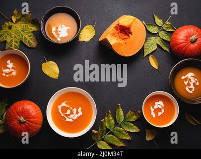Plates with cream pumpkin soup copy space Stock Photo