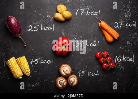 Vegetables and calorie counting top view Stock Photo