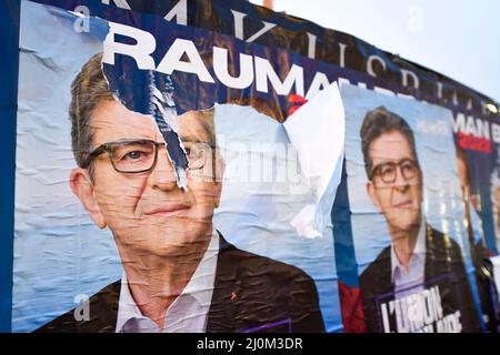 Poster of Jean-Luc MELENCHON (far-left political party La France Insoumise, LFI). Posters for the 2022 French presidential election campaign bloom on city walls, before being very quickly torn off by the opposing gluers on March 19, 2022 in Paris, France. Stock Photo