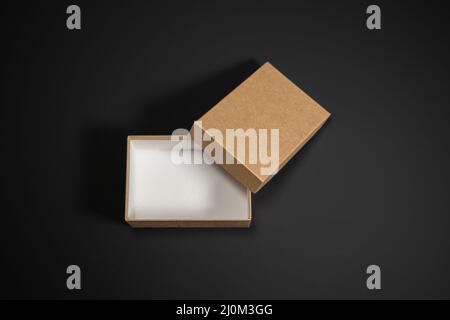 Wrapped vintage gift boxes with red ribbon bow, isolated on black Stock Photo