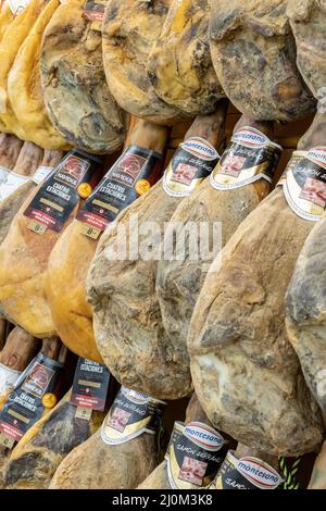 Santa Cruz de Tenerife, Spain - March 19th, 2022: Serrano ham legs for sale in a supermarket in Spain. Stock Photo