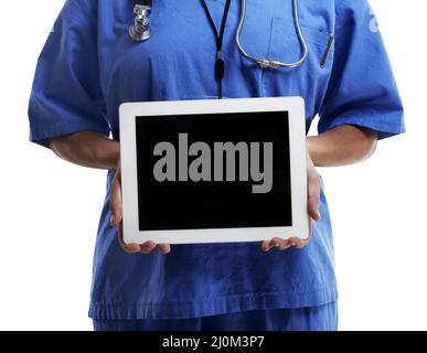 Find the right doctor for you online. Cropped studio shot of a doctor showing you the blank screen of a digital tablet against a white background. Stock Photo