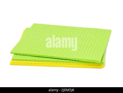 Stack of rubber sponges for washing dishes and cleaning the house on a white background Stock Photo