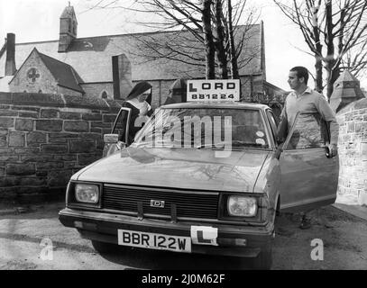 A picture from a series of humurous novelty images taken by Sunday People photographer Dennis Hutchinson. - Lord Driving School, Whickham. Nun better probably !! says Dennis.    Datsun Sunny,    Circa : 1981 Stock Photo