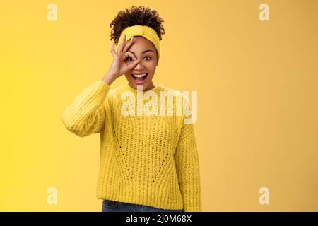 Dreamy impressed excited african-american female university student speechless smiling drop jaw look awesome future show okay ok Stock Photo