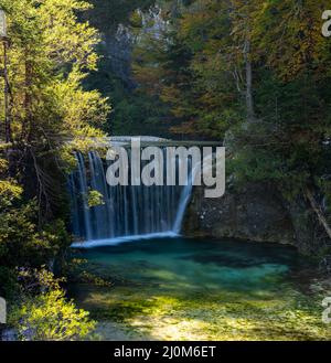 A view of the Pisnica Waterfall near Kranjska Gora in the Julian Alps of Slovenia in late autumn Stock Photo