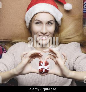Christmas Eve. Girl with a Christmas present. Festive mood. Thematic image Stock Photo
