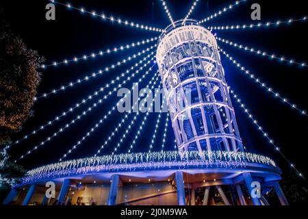 Lighthouse of the night view of Enoshima (sea candles) Stock Photo