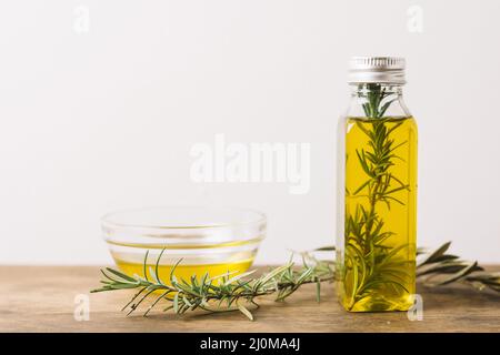 Horizontal shot olive oil with rosemary copy space