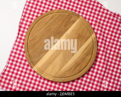 Empty round wooden cutting kitchen board on a white background, pizza board Stock Photo