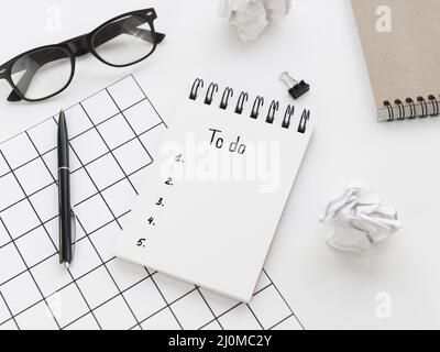 High angle list notepad with glasses pen Stock Photo