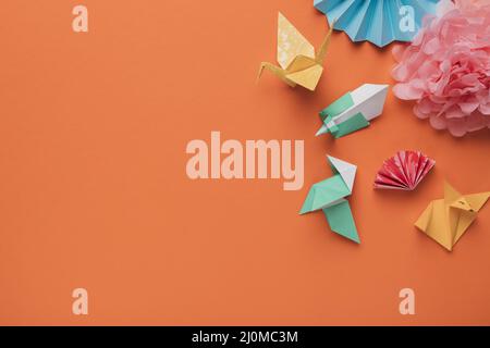 High angle view origami paper art craft orange surface Stock Photo
