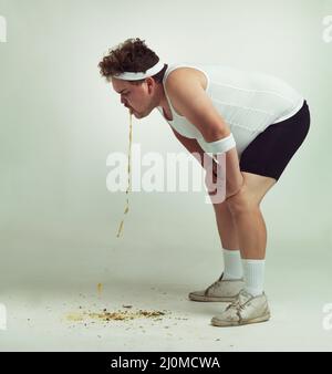 No Bro... Im Cool... I end all exercises with a bit of abdominal exercise. Overweight man getting sick after doing exercise. Stock Photo