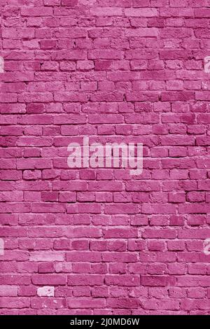 Pink brick wall. Loft interior design. Pink paint of the facade. Architectural background. Stock Photo