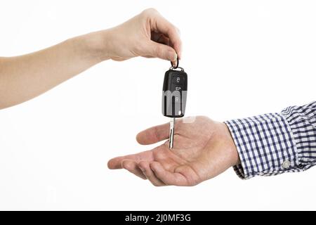 Hands exchanging car keys Stock Photo