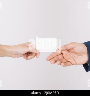 Hands exchanging business card Stock Photo