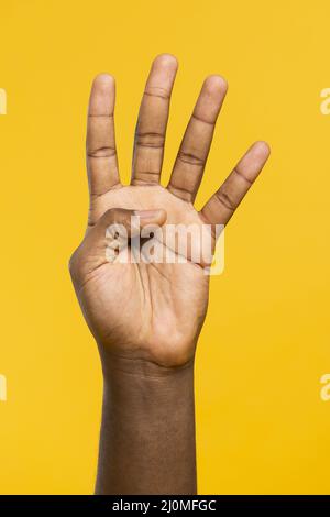 Male hand showing number four isolated on white Stock Photo - Alamy