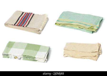 Folded linen kitchen towels on white background, set Stock Photo