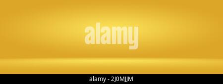 Gold shiny backdrop with variating hues studio background. Stock Photo