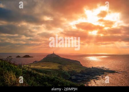 The distinctive headland juts out into the ocean where two great bodies of water meet. Part of the Tin Coast and Cornish Mining World Heritage Site. Stock Photo