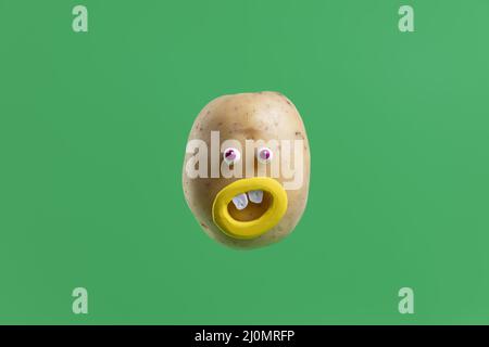 Funny potato with face sticker Stock Photo