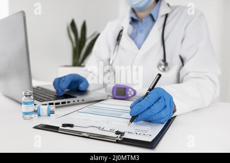 Close up doctor working laptop Stock Photo