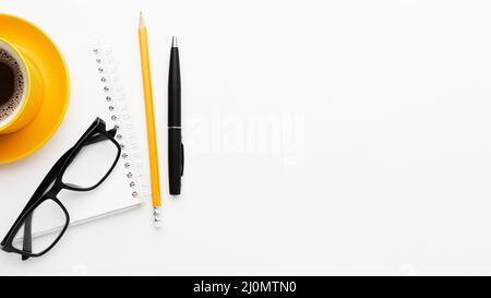 Flat lay frame with glasses pen Stock Photo